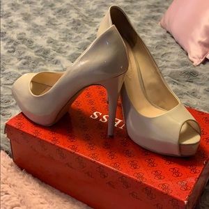 Nude patent leather high heels.